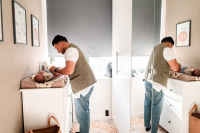 Kraamreportage-Almere-57 Papa kleedt de baby aan tijdens de kraamreportage aan huis in Almere